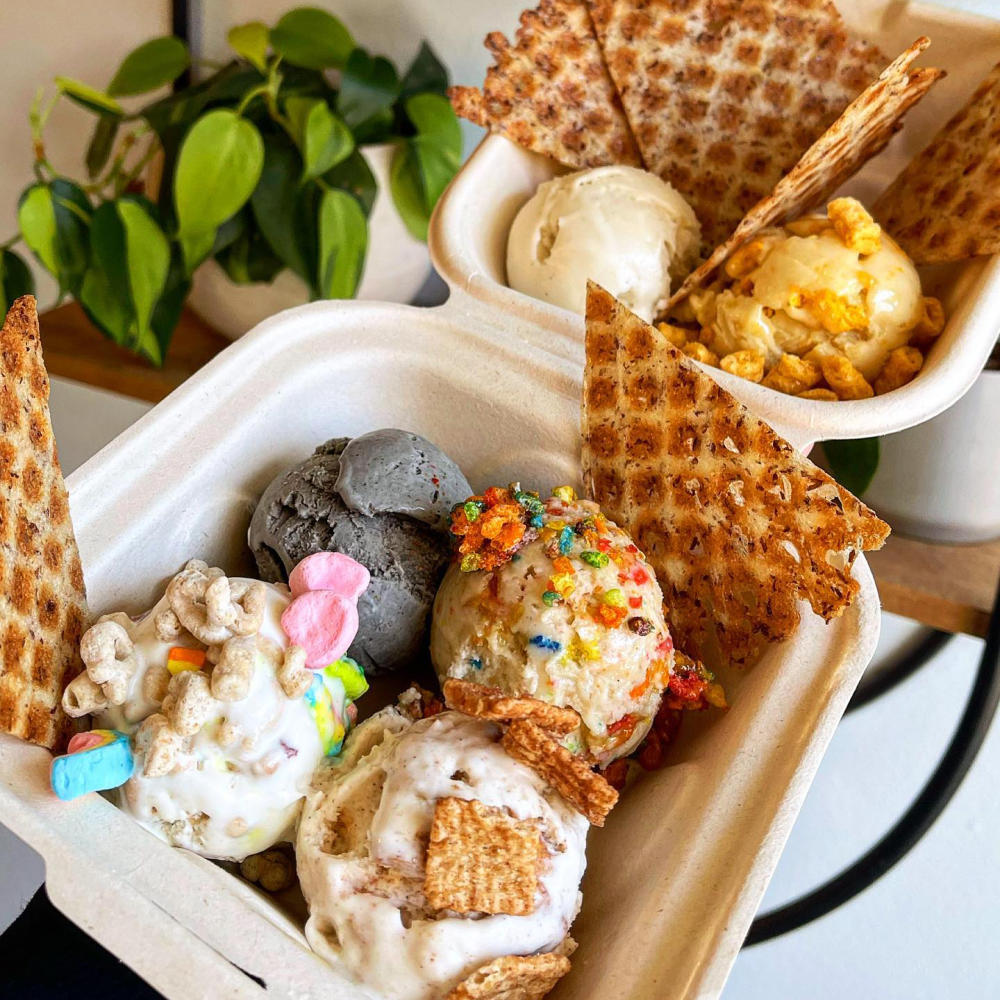 container filled with scoops of different flavored ice cream