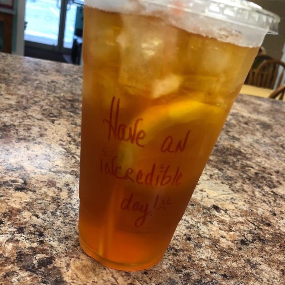 to-go cup that says have an incredible day at Something's Brewing
