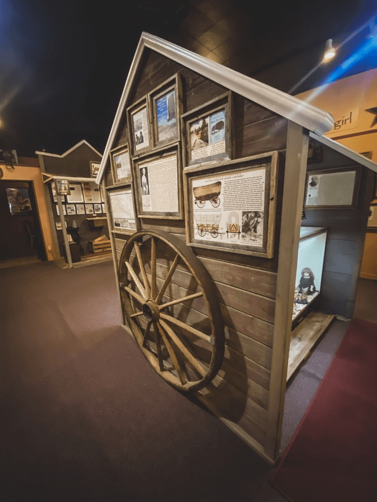 A wooden wagon wheel on display at the Cowgirls of the West Museum in Cheyenne, Wyoming.