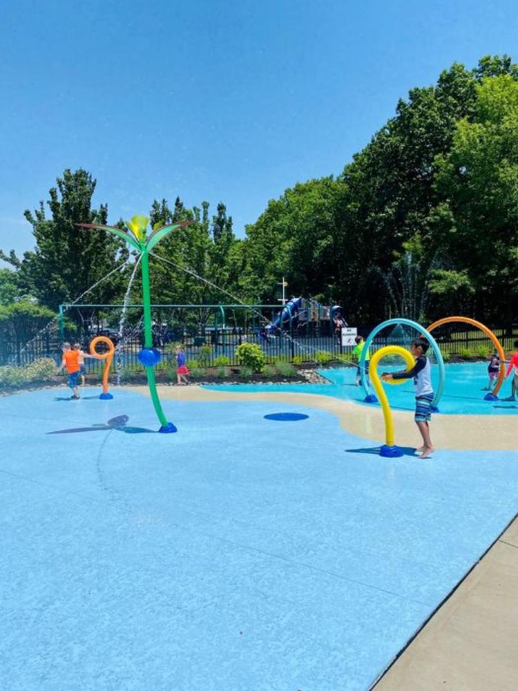 Kids playing in a small waterpark