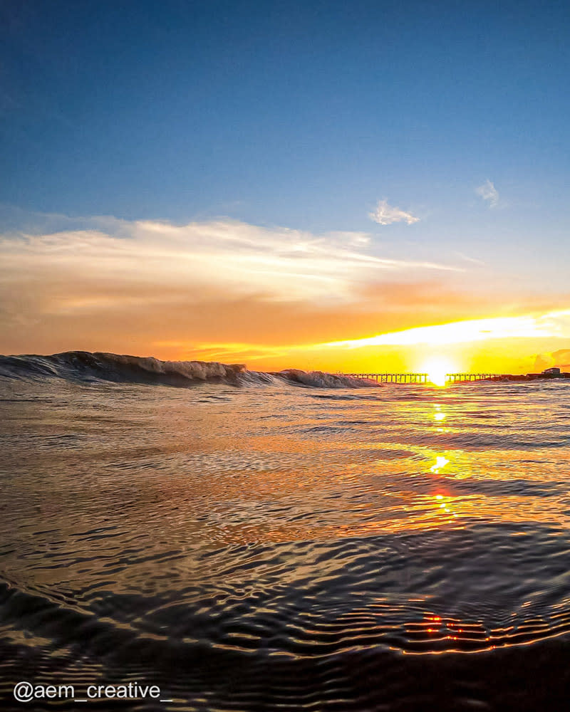 Sun setting over the ocean in Oak Island, North Carolina.