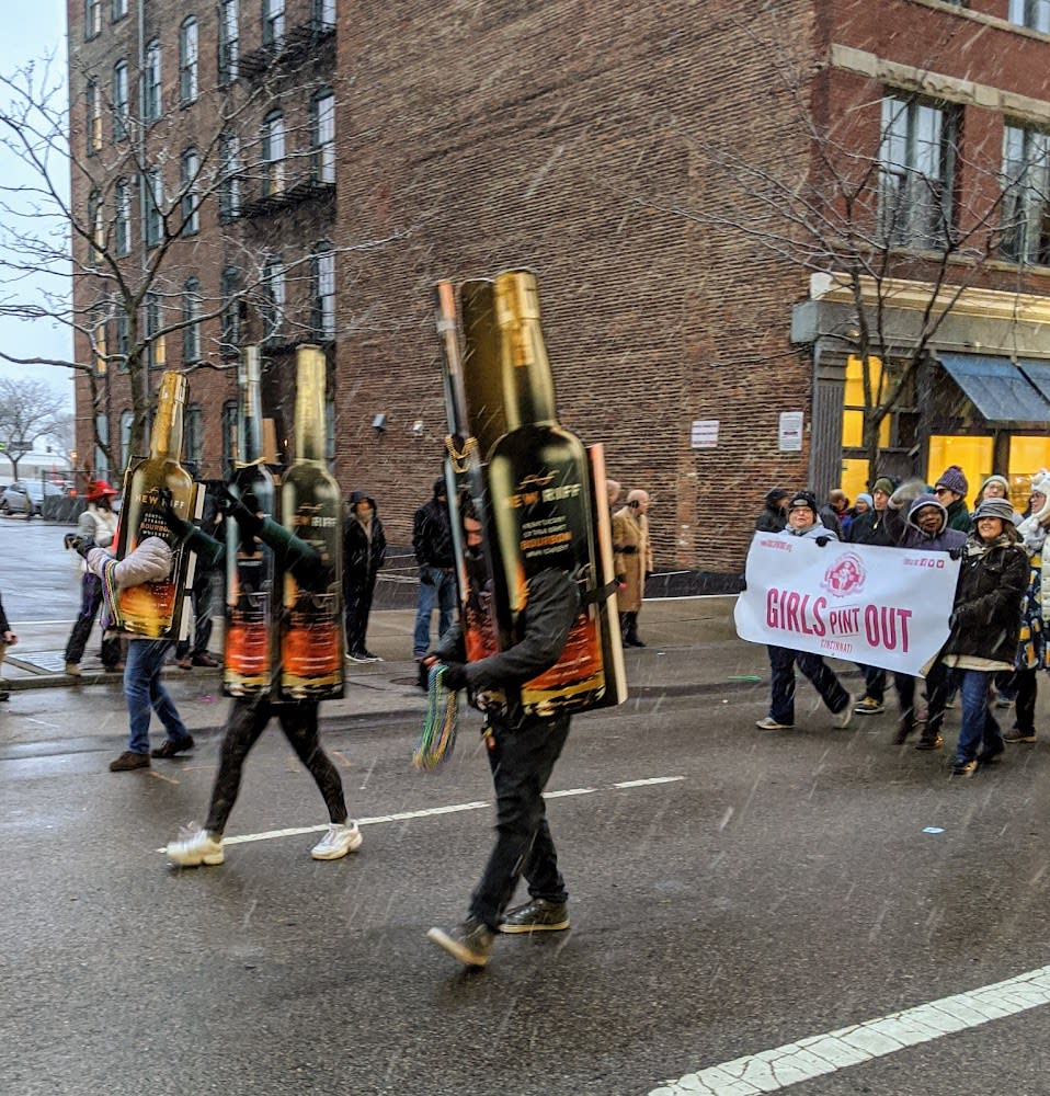 People dressed as bottles of New Riff bourbon in the Bockfest parade