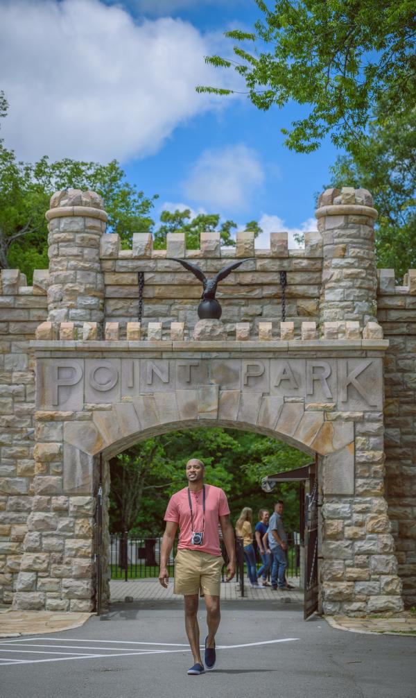 Man walks under point park gate