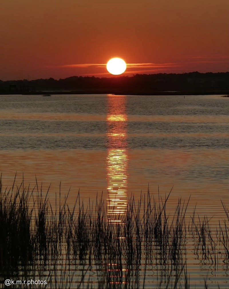 Sunset at the Point in Oak Island, North Carolina.