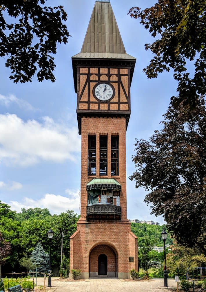 The brick Carroll Chimes Clock Tower in Mainstrasse Village on a sunny day
