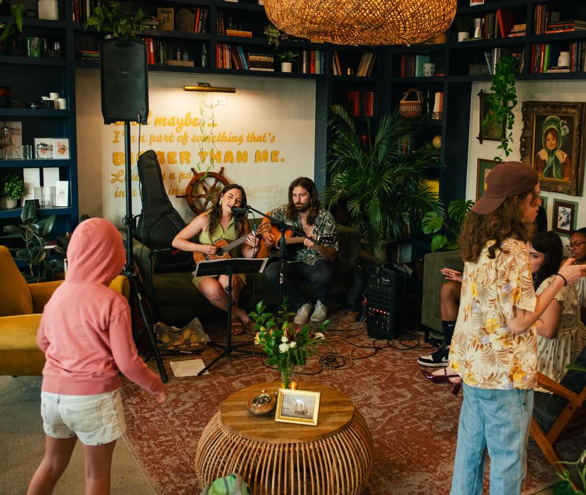 A duo performs at Haven Coffee & Cocktails while patrons watch and dance.