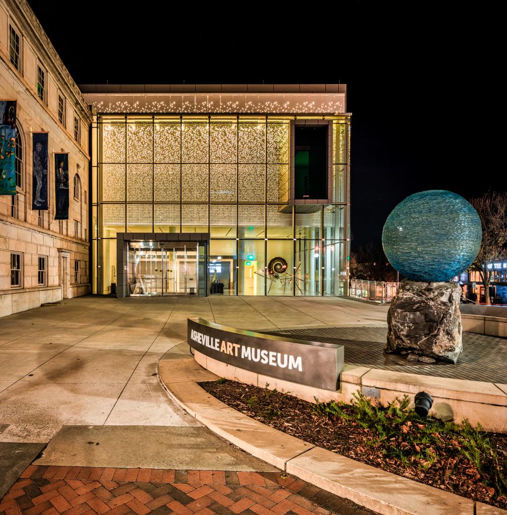 The Asheville Art Museum illuminated at night in Asheville, NC