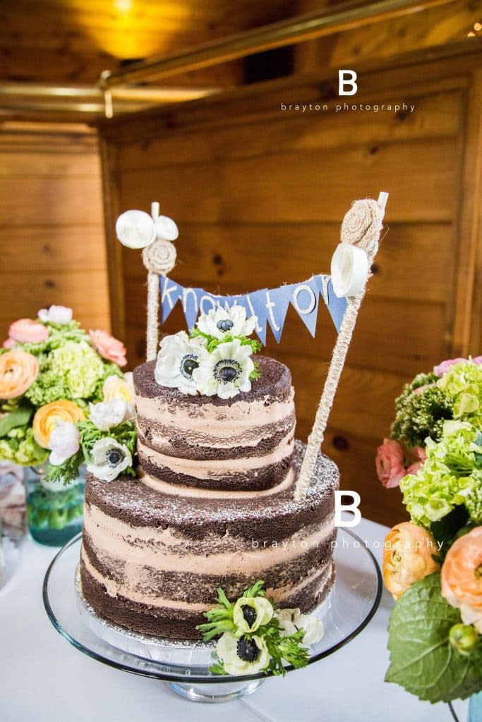 chocolate wedding cake with white poppies