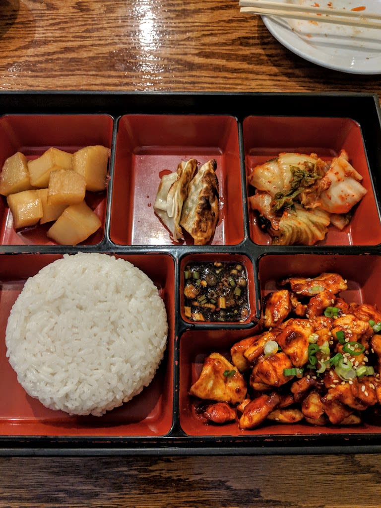 Tray with six sections filled with various Korean food at Riverside Korean in Covington, Ky.