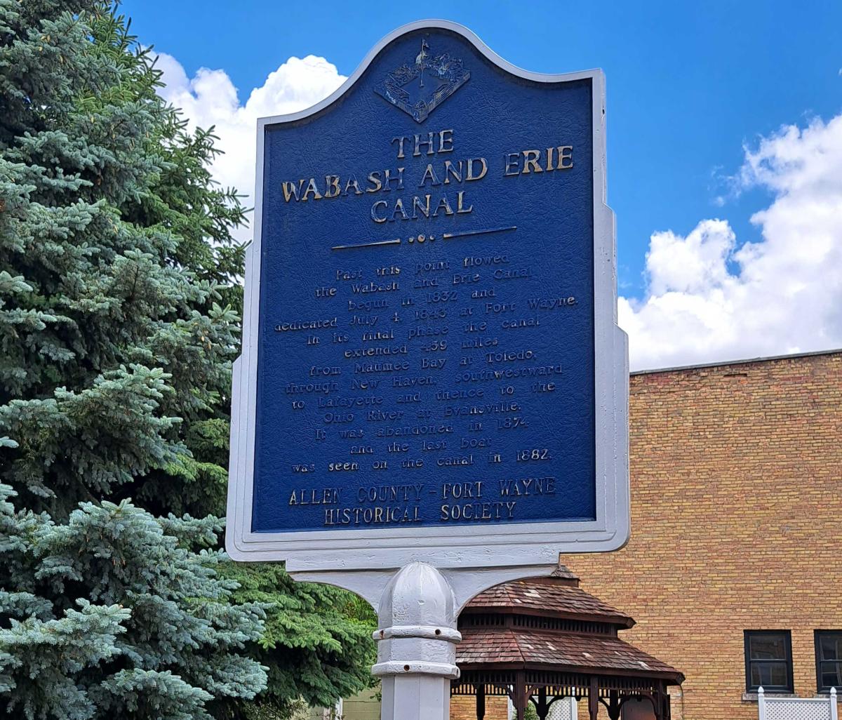 Blue, patinaed commemorative plaque at New Haven Canal Landing Park that says, "The Wabash and Erie Canal"