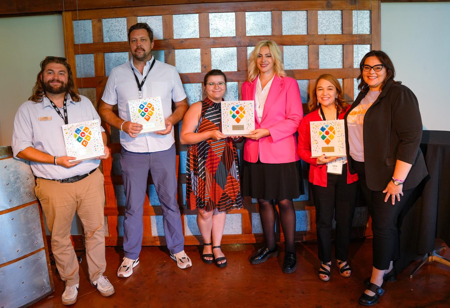 4 winners with their stained glass award together