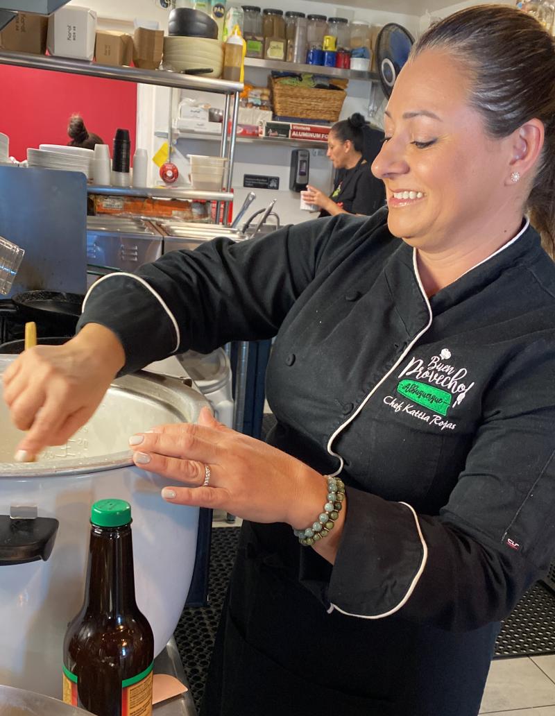 Chef and owner Kattia Rojas stirs a pot of rice at Buen Provecho restaurant