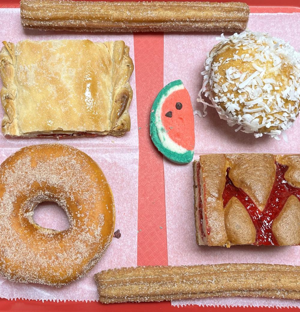 seven pastries on a red tray