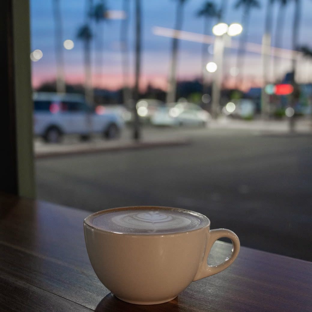 Coffee on a table looking out the window