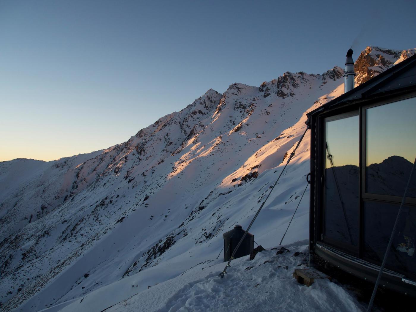 Early mountain at Mountainhut Accommodation, surrounded by snow-covered mountains