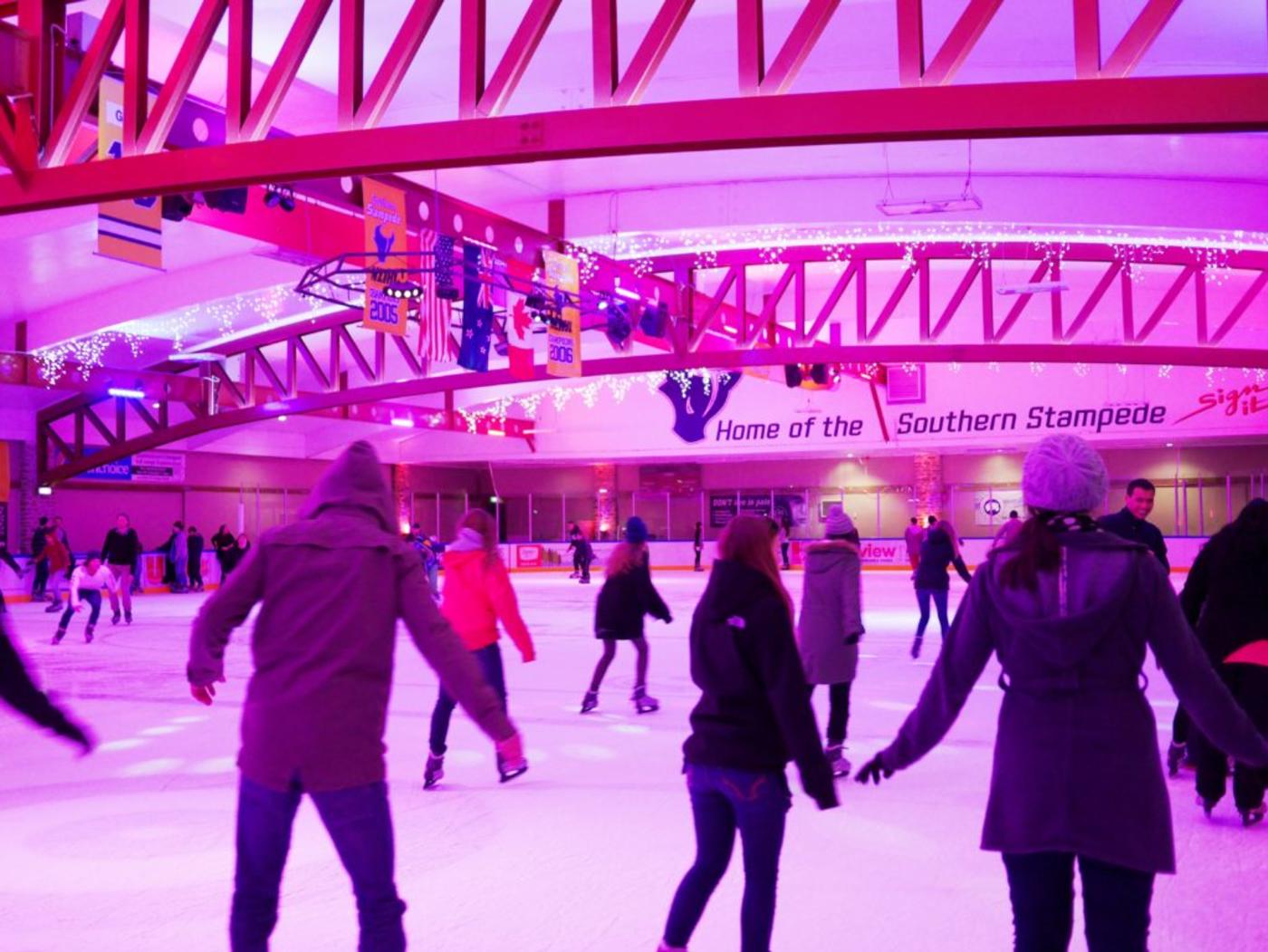 People ice skating at Queenstown Ice Arena