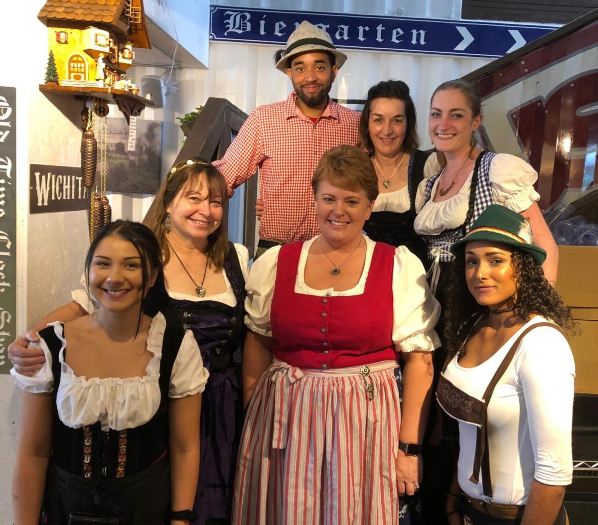 A group of people pose for a photo at Prost's Oktoberfest