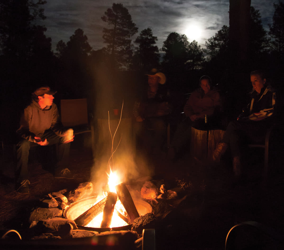 Riders around the campfire at Geronimo Trail Ranch