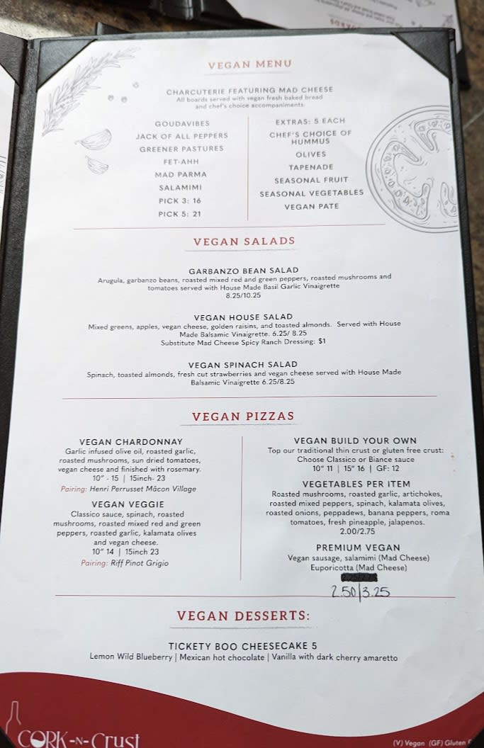 An entire page of the Cork-N-Crust gourmet pizza menu is devoted to vegan choices for salads, pizzas, charcuterie, and dessert.
