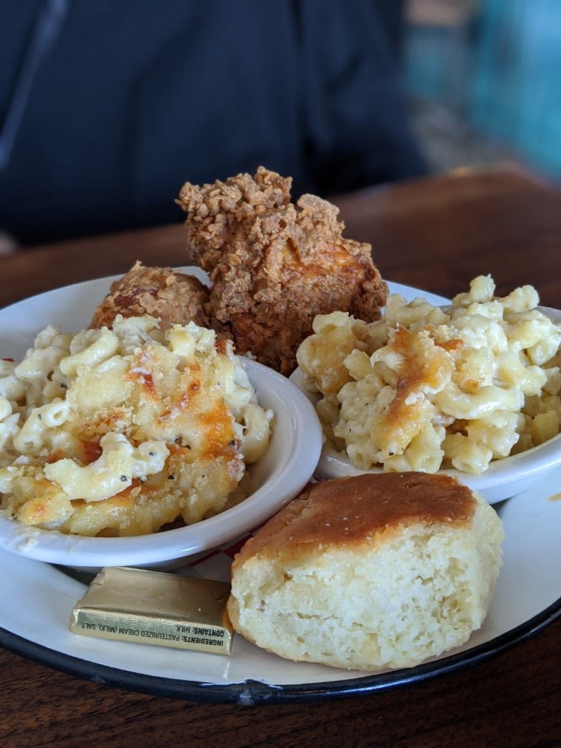 two servings of mac and cheese, with a biscuit and piece of fried chicken at Libby's in Covington, Ky.