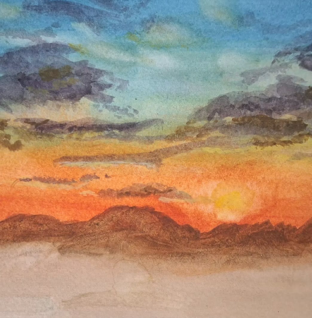 A watercolor painting by Patty Gibbons depicts a serene sunset with orange hues over distant mountains. Dark clouds float across a blue sky, conveying tranquility.