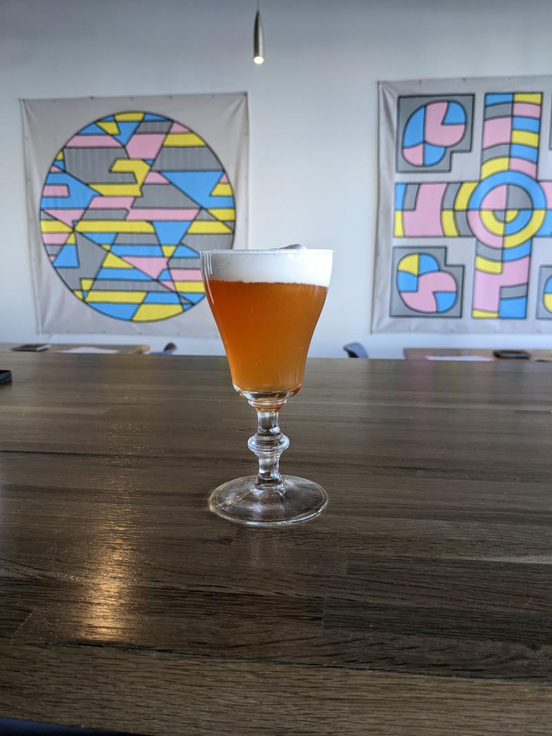 A hojicha pie drink from Lost Cultures Tea Bar sits on the bar.