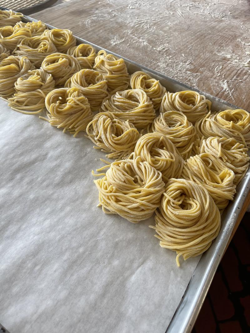 Fresh pasta on a tray.