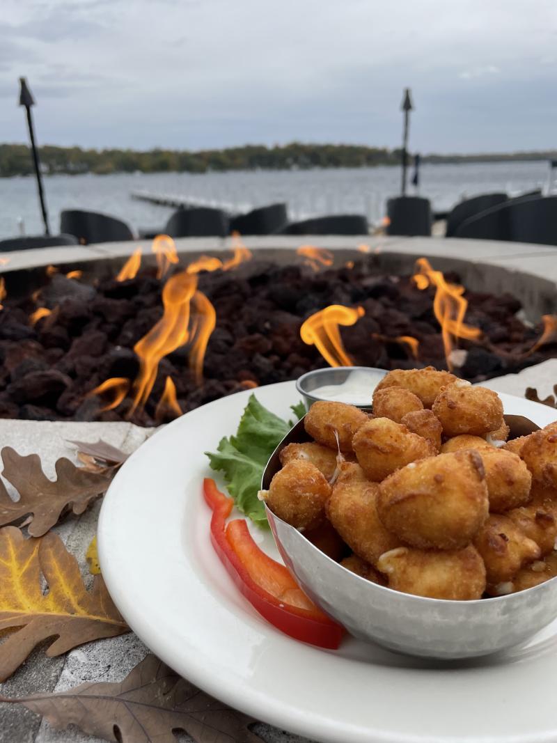 Dish of cheese curds served by the fire at Pier 290