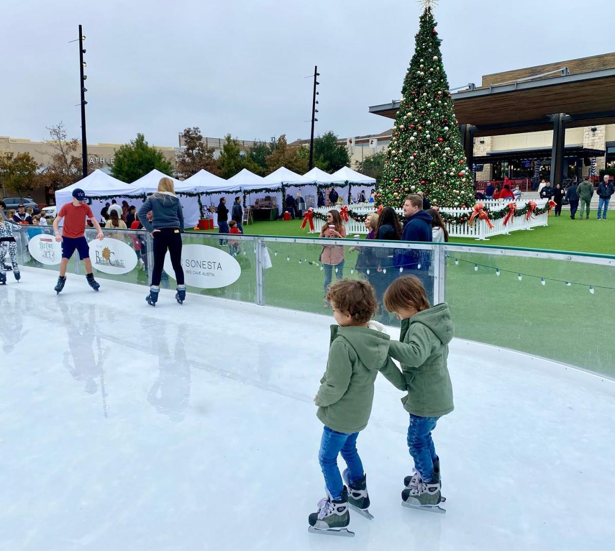 Image of two kids skating on the ice at the Hill Country Galleria.