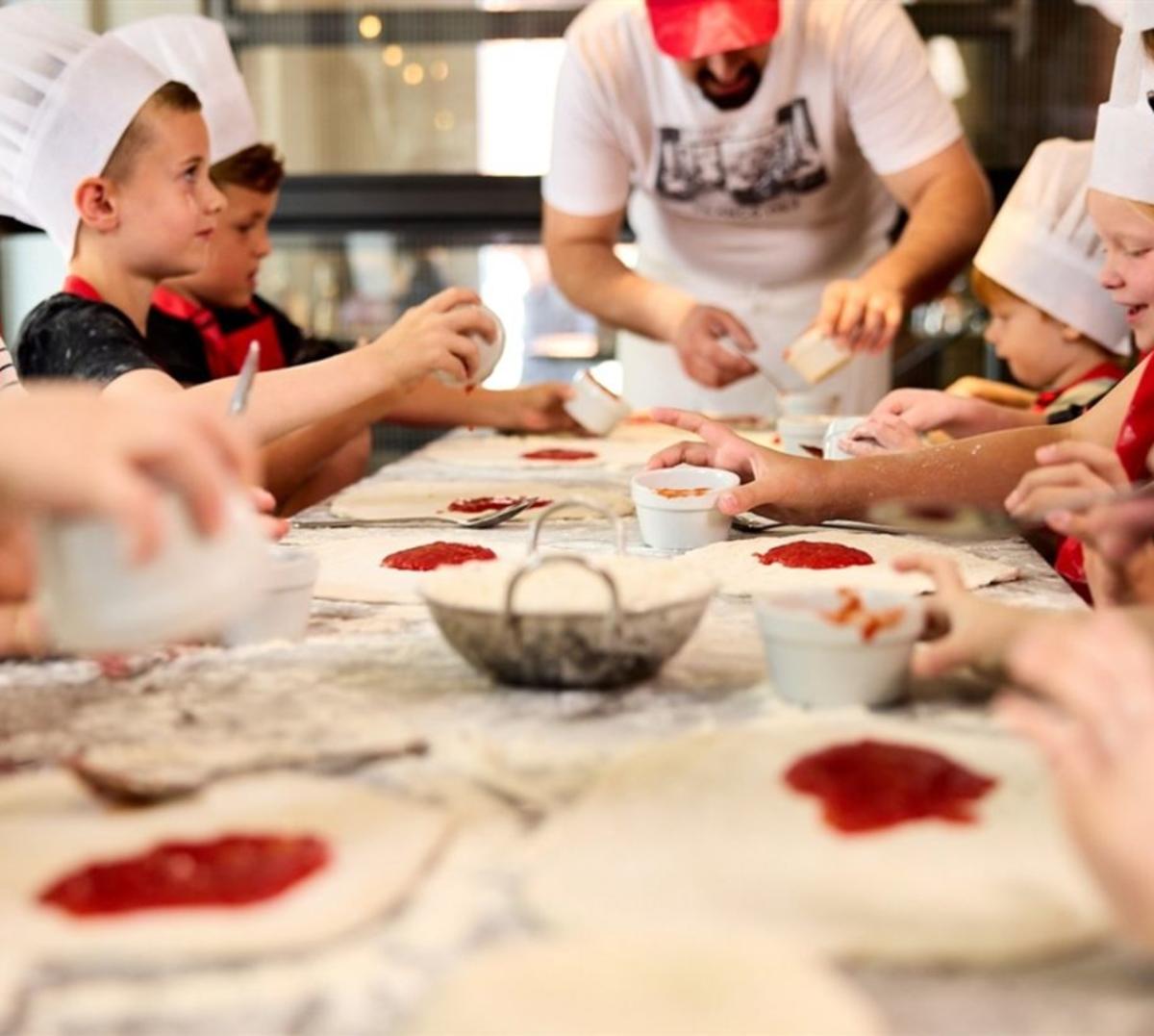 Children making pizzas at Franco Manca