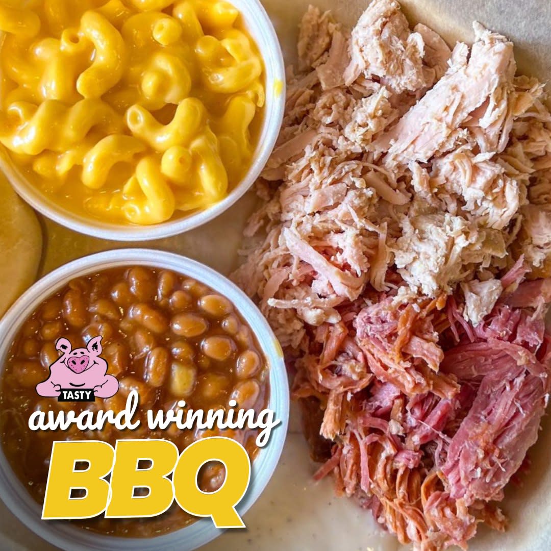 plate of LawLers Barbecue with sides of mac and cheese and baked beans