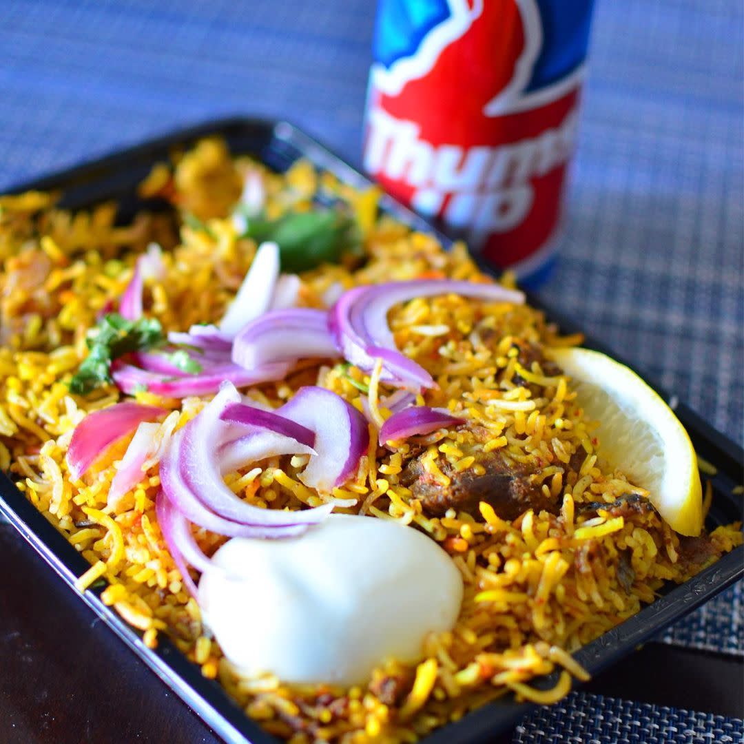 Turmeric Express in Chandler food in to-go container with a beer