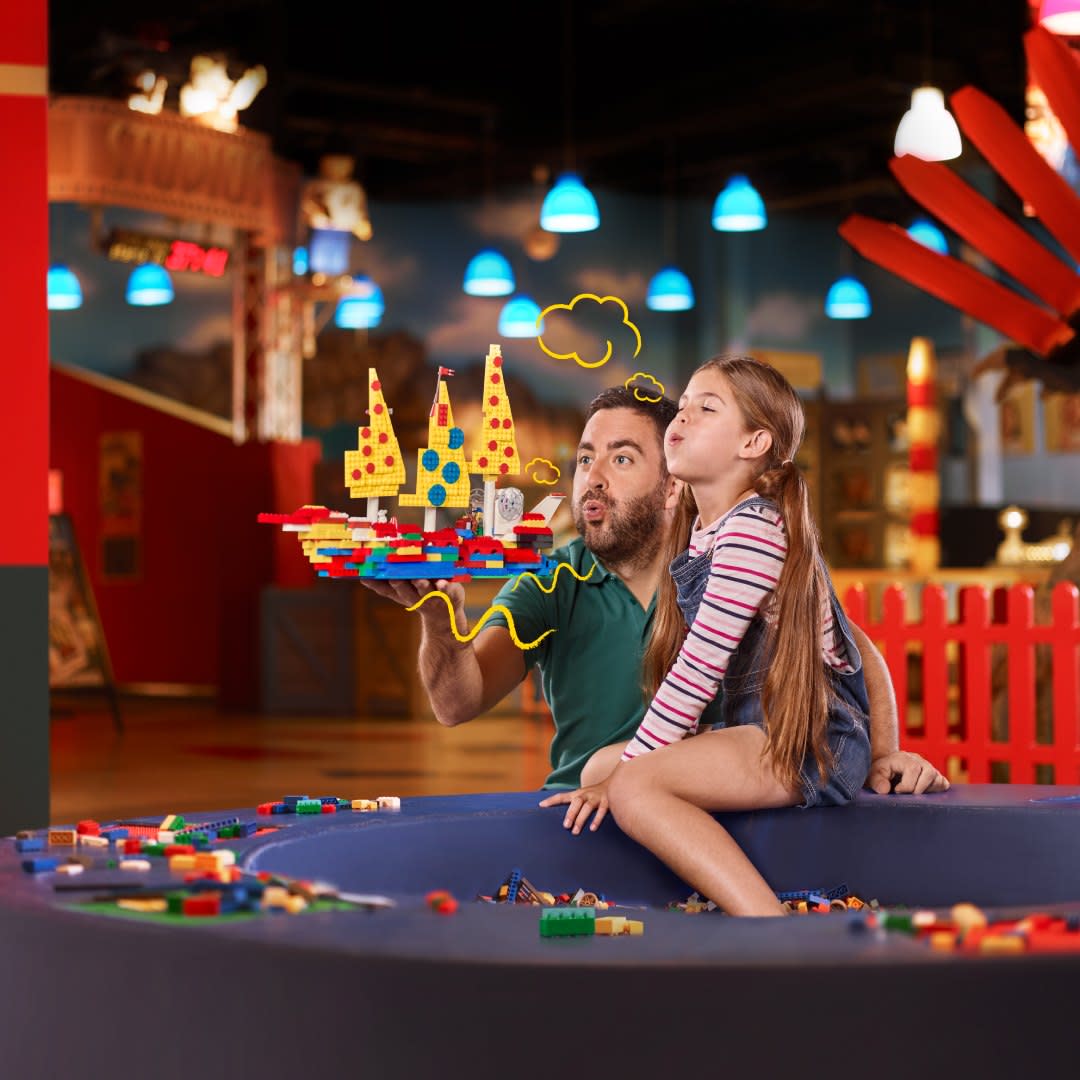 Girl and Dad playing at Legoland