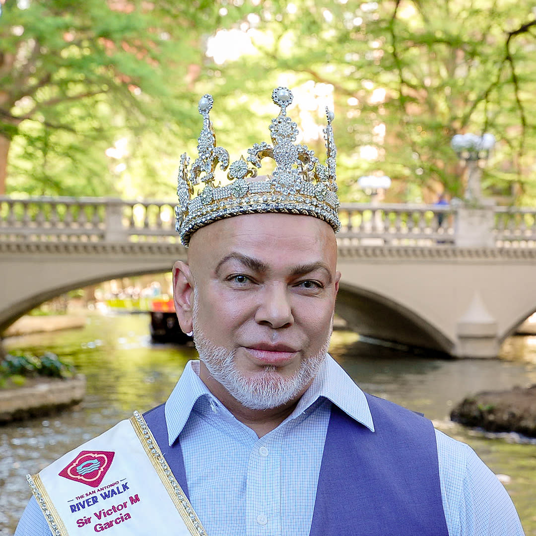 Man in crown and sash