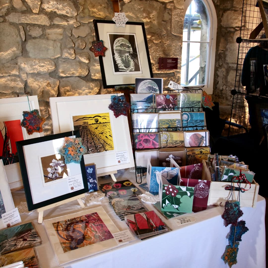 Winter Makers Market stall at God's House Tower filled with prints