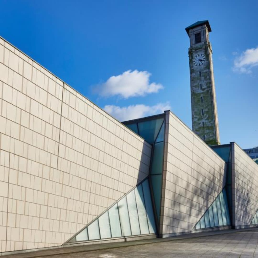 SeaCity Museum and clocktower exterior on a partly cloudy day