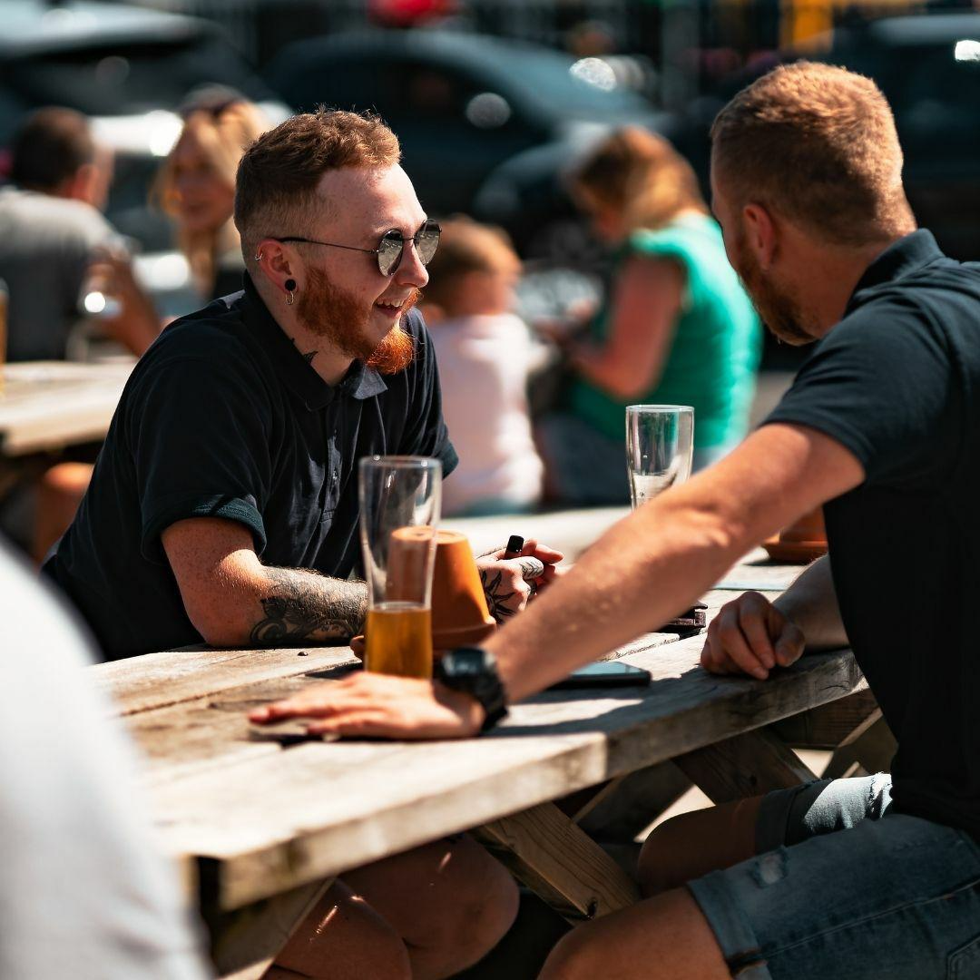 Two men drinking beer