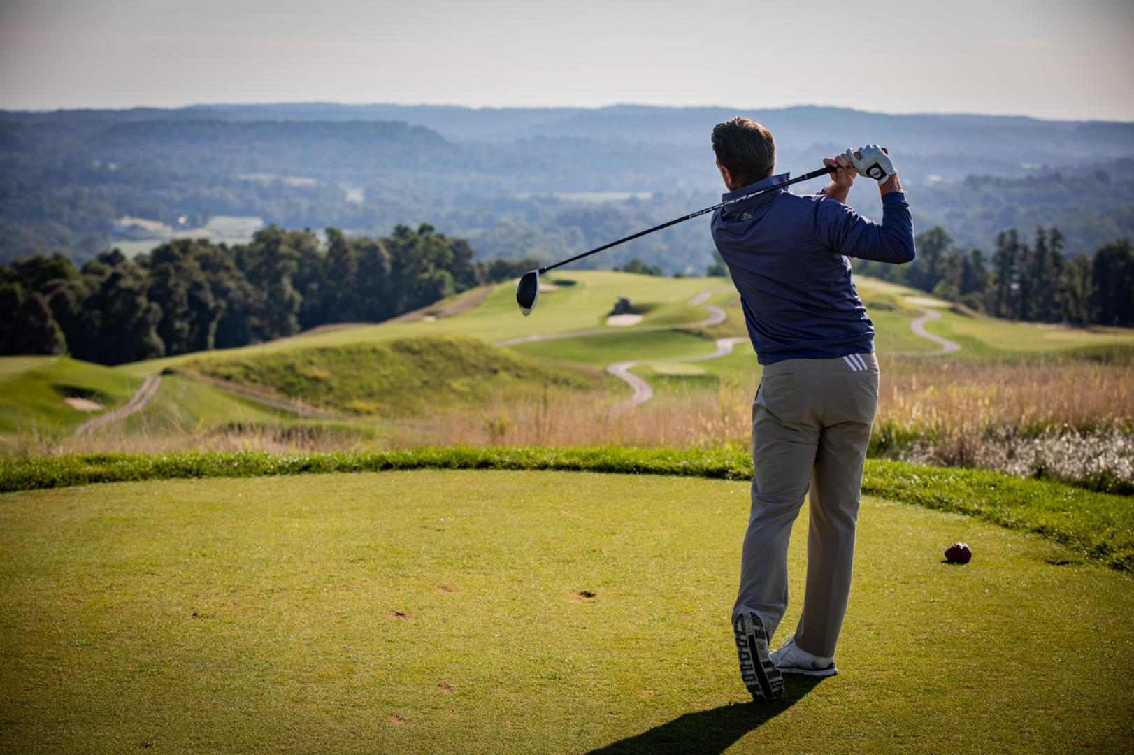 A man golfing on a golf course in Southern Indiana