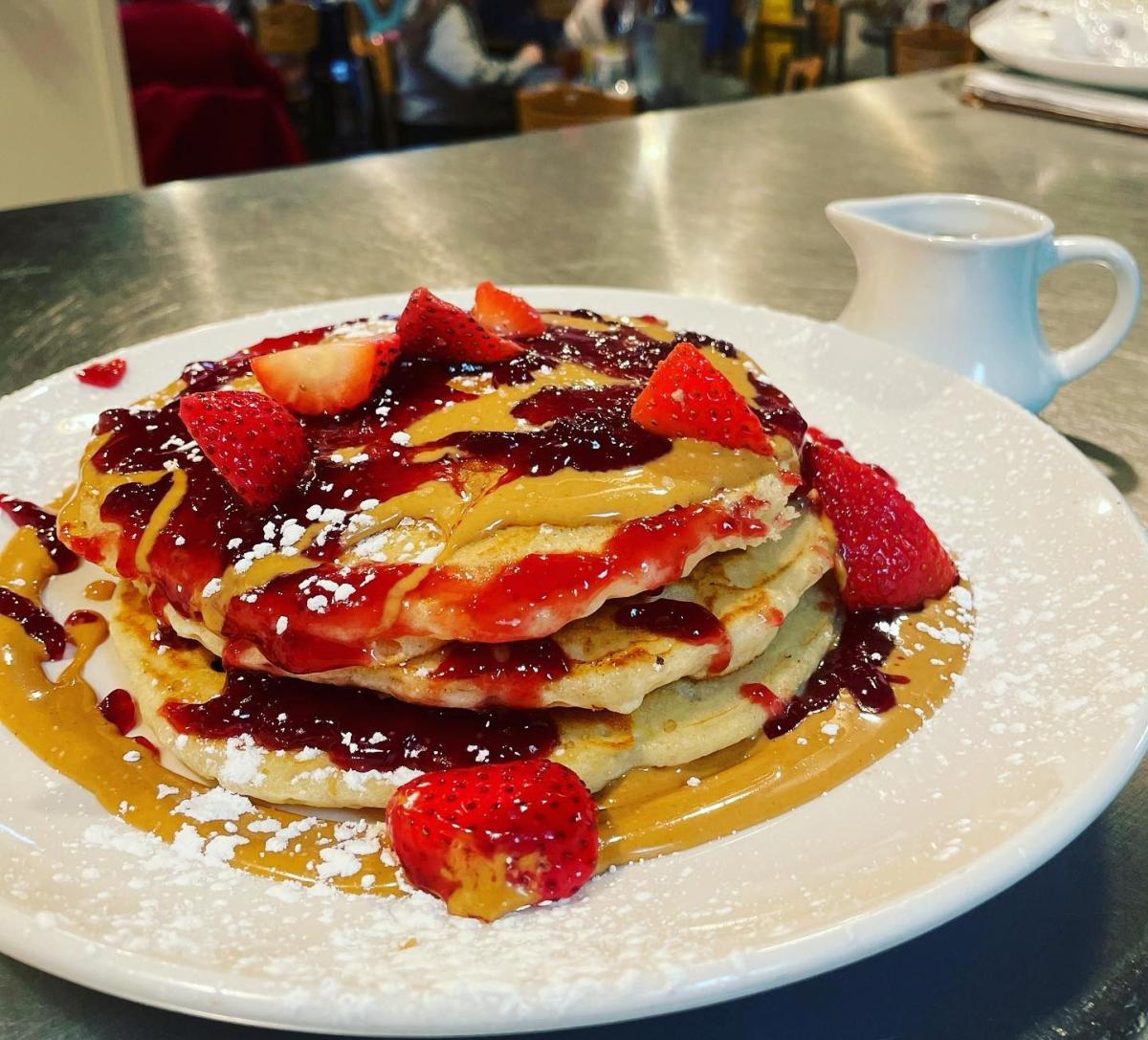 Market Cafe pancakes with syrup and strawberries