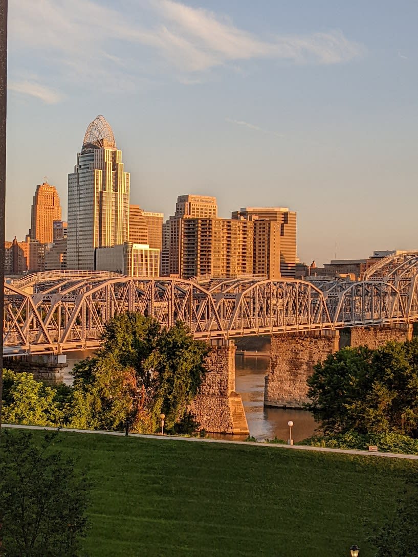 Image is of the Purple People Bridge with the view of Cincinnati behind it.