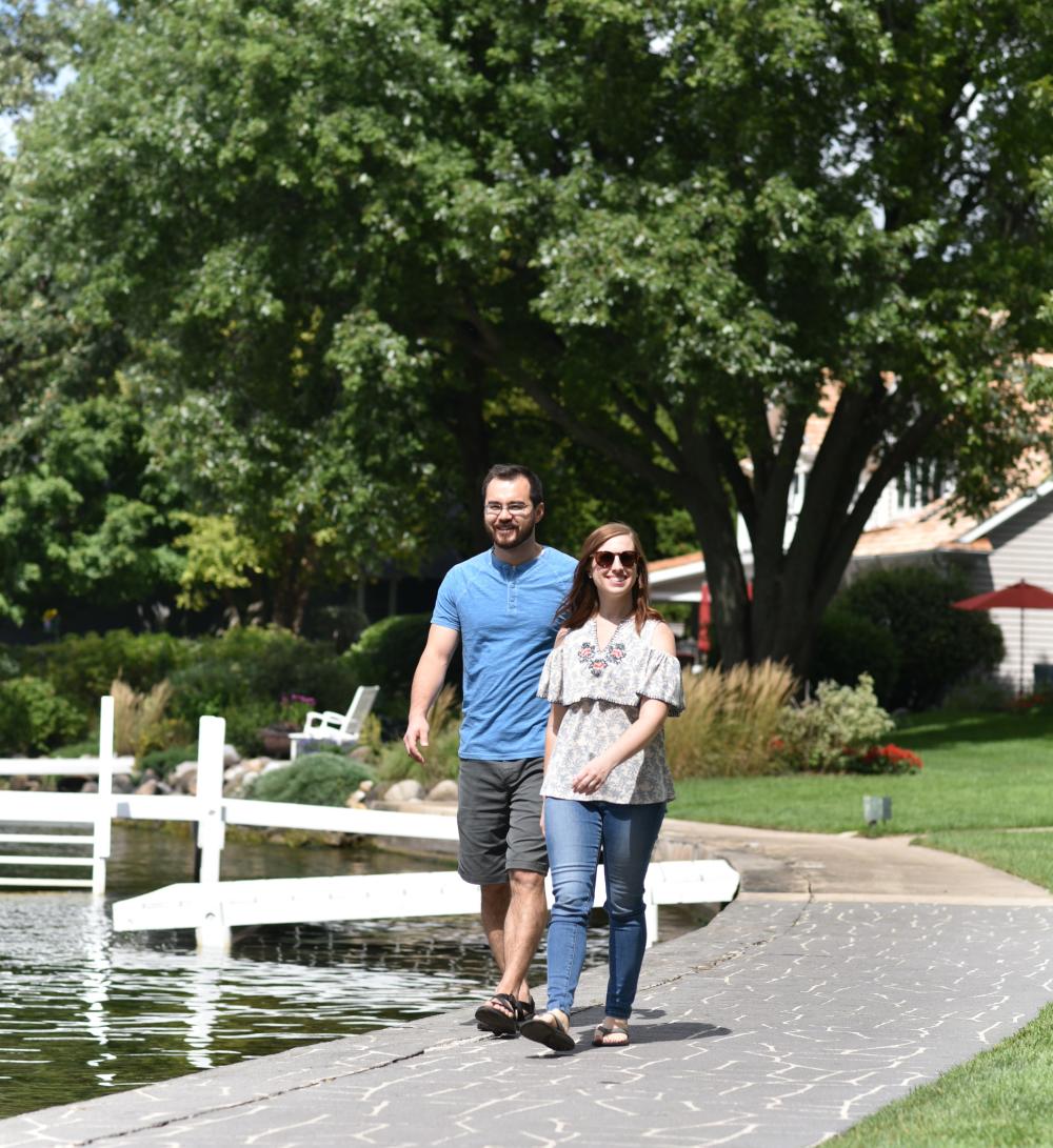 Couple walking the lakeshore path