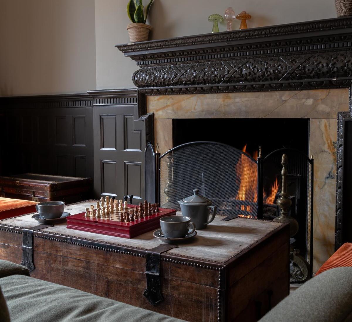 Fireplace and chess at New Park Manor Hotel in the New Forest