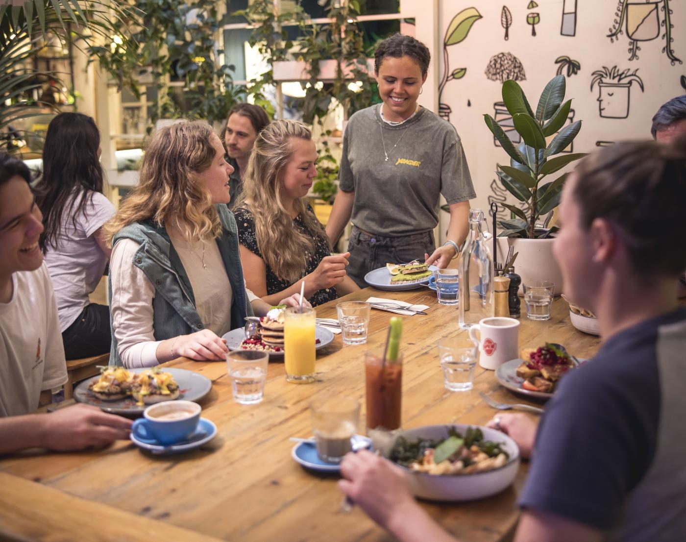 Group of friends enjoying breakfast at Yonder Café.