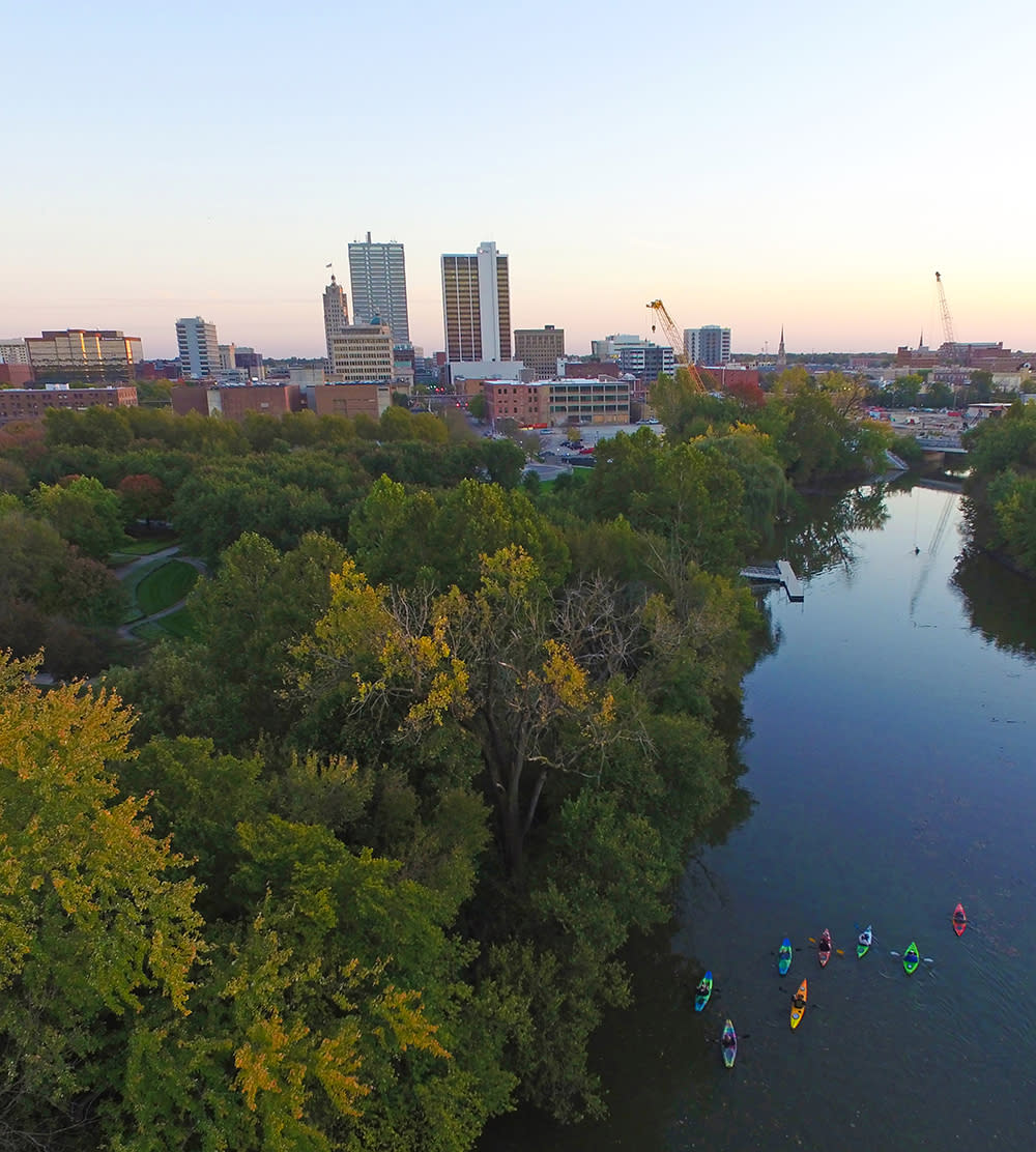Kayakers Cruise the Downtown Rivers at Sunset
