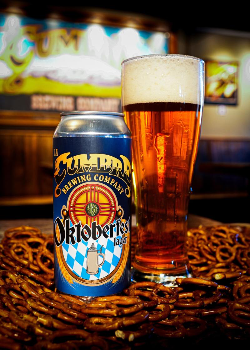 A can of La Cumber's Oktoberfest beer sits in front of a glass of Oktoberfest beer.