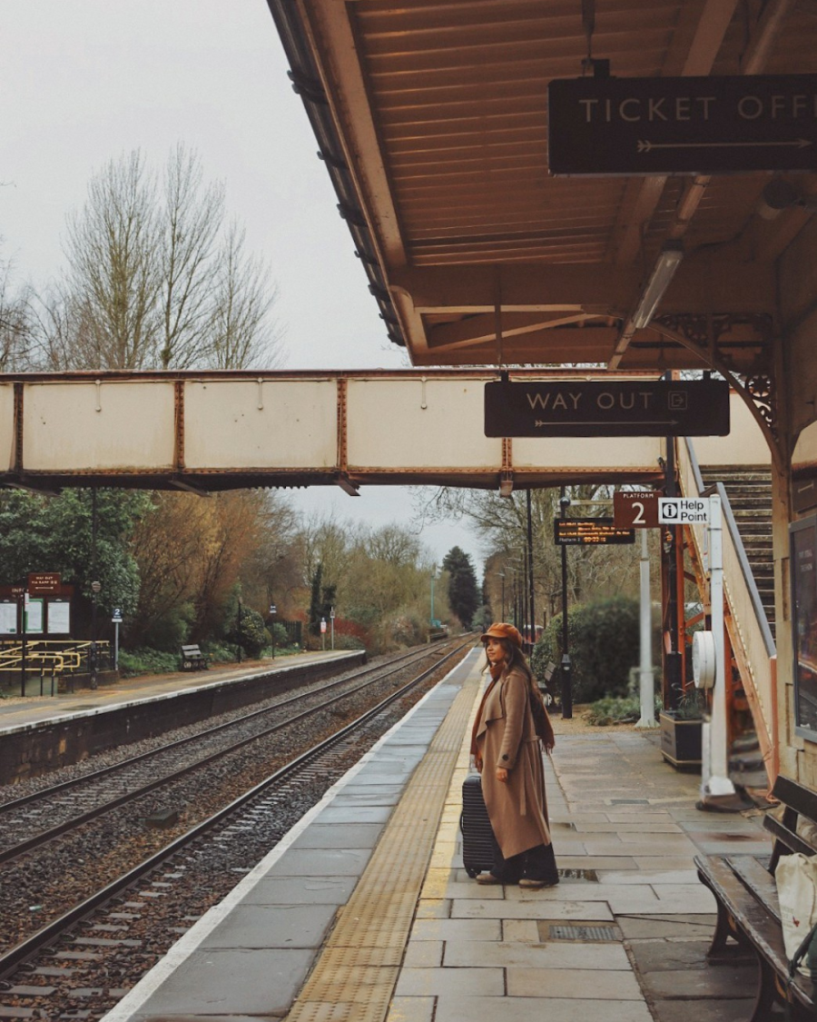 Steph waiting for a train at Kemble station in the Cotwolds