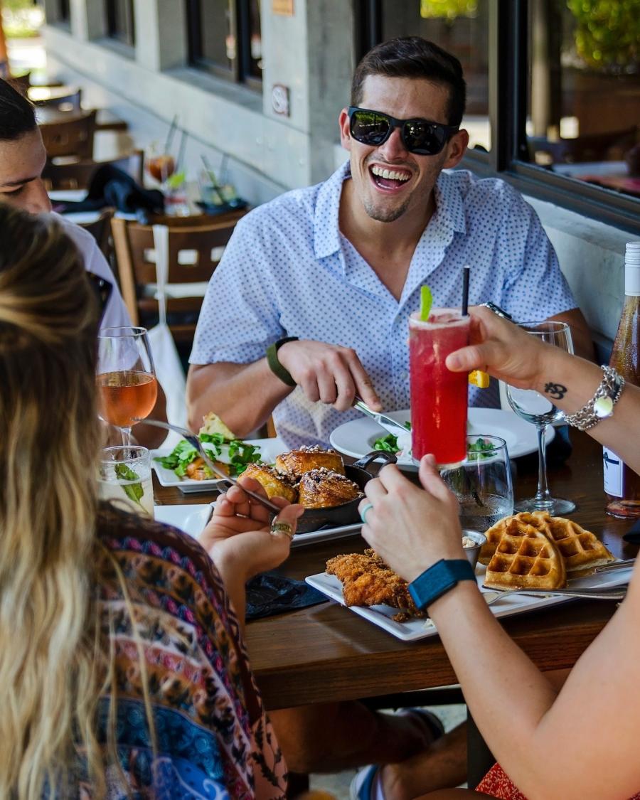 Three friends having brunch outside of the Foundry.