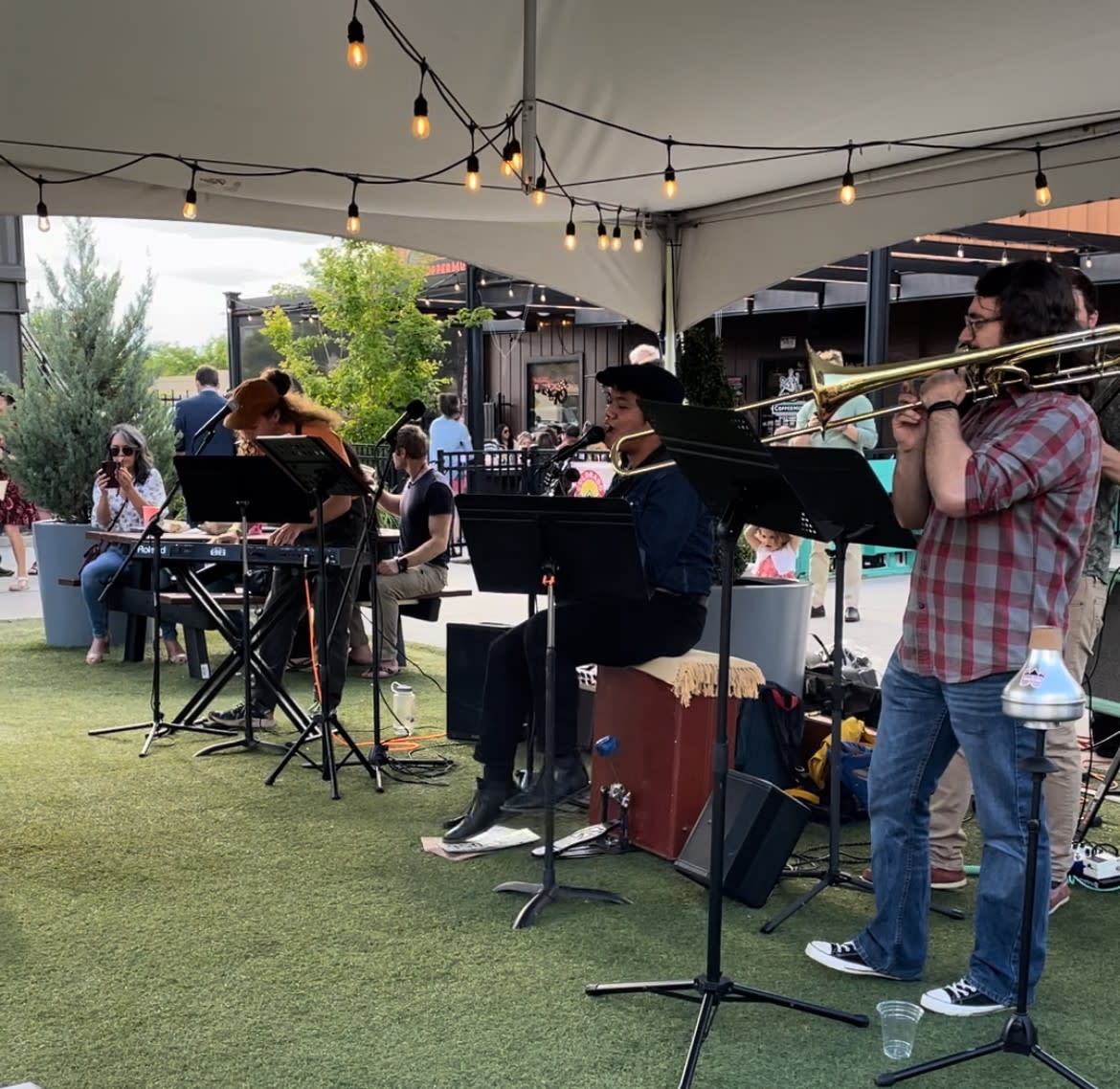 A band plays under a tent at the Evening of Swing