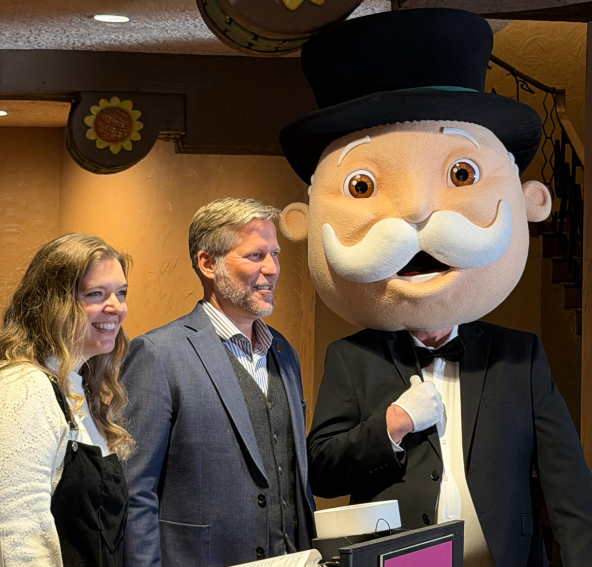 Katie Hubbard, Sales Executive with Top Trumps USA Inc., Mayor Tim Keller, and Mr. Monopoly at a press conference announcing the game.