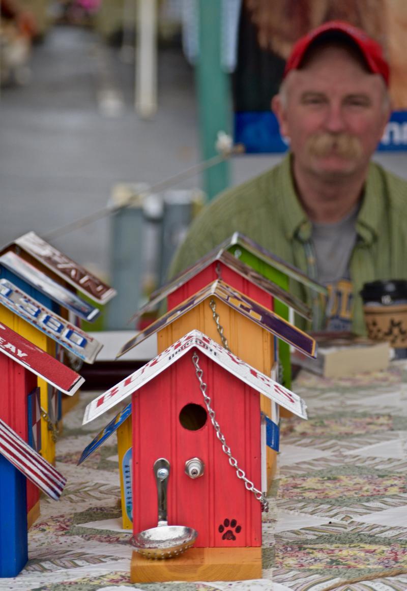 handmade bird houses at an open air market